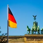 A german flag waving at Brandenburg Gate