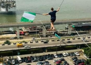 Guinness World Records holder Jaan Roose walks on a rope in Lagos