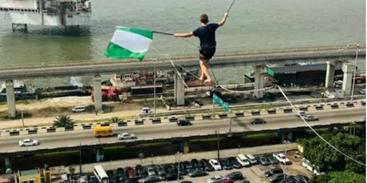 Guinness World Records holder Jaan Roose walks on a rope in Lagos